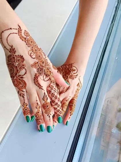 A lovely party henna design done for a client, with delicate floral vines.