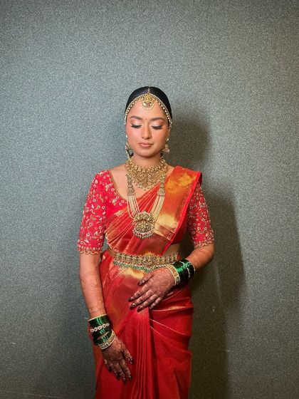Another angle of the full look, showing the intricate details of her saree and jewellery.