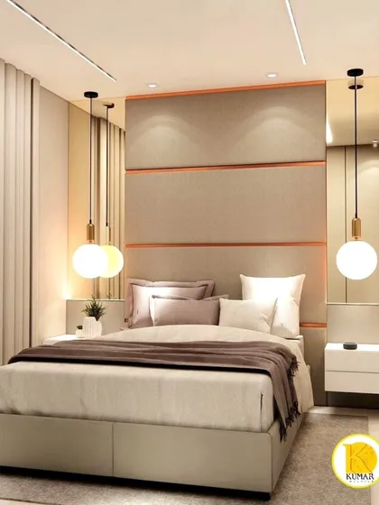 This bedroom features a padded headboard with copper-colored metal inlays, adding a touch of warmth and luxury.