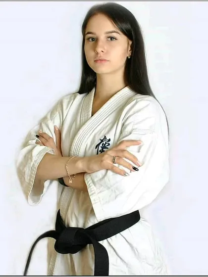 The determined look of a black belt. The journey to this level requires immense discipline and a "no pain, no gain" attitude, which we cultivate in all our students.