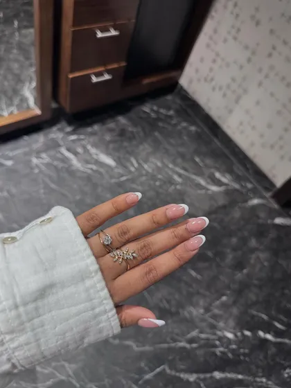 A perfect, classic French manicure on beautifully shaped almond nails. This look is timeless, clean, and always elegant.