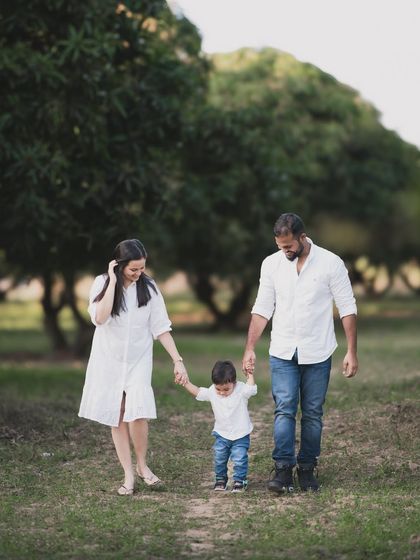 A family taking a walk together outdoors. These lifestyle shots capture your family in motion.