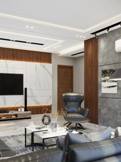 This angle highlights the different textures and materials used, from the smooth marble floor to the rough concrete wall and warm wood panels, creating a rich and dynamic interior.