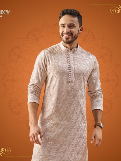 Celebrate Diwali in style with this intricately designed embroidered kurta. The subtle texture and elegant pattern add a refined touch to your festive wardrobe.
