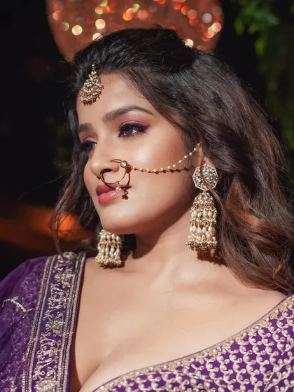 Reception look inspiration for a bride who loves color. I used shades of purple and pink on the eyes to complement her gorgeous lehenga.