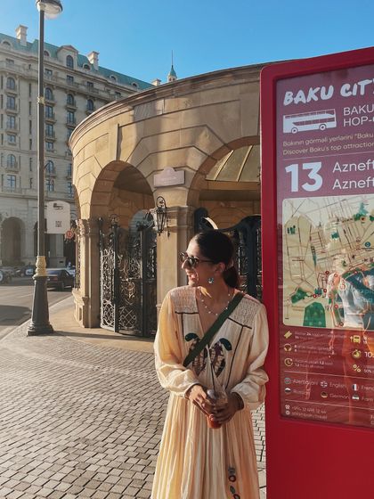 Waiting for the bus in Baku. My travel style is all about being ready for anything, and this embroidered dress is both beautiful and practical.