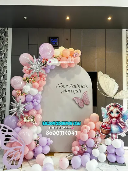 I designed this elegant butterfly theme for Noor Fatima's Aqeeqah ceremony. The soft pastel balloons in shades of pink, purple, and white, along with sparkling starbursts, create a dreamy and delicate backdrop for welcoming your little one.
