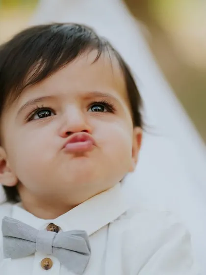 A classic baby pout. This expressive close-up is full of personality and is a fun addition to his gallery.
