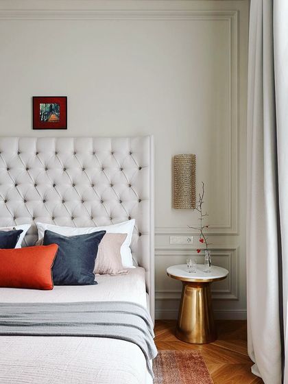 Headboards with wall mouldings are a perfect combination for your bedroom. This design features a classic button-tufted headboard against a wall with simple, elegant trim work.