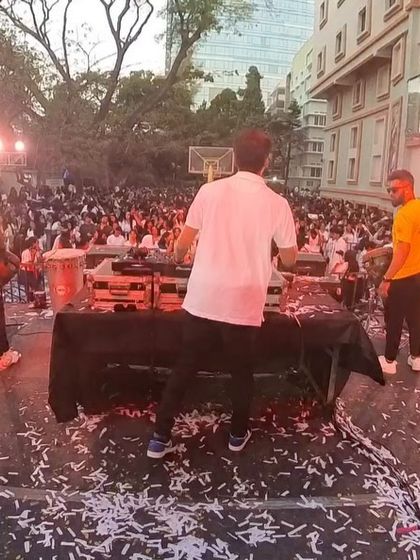 On stage with the Beat Gurus percussion team, with confetti covering the ground after a huge drop.