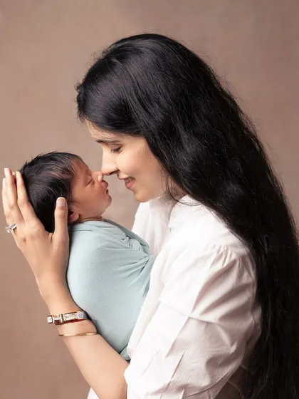 The connection between a mother and her newborn is a story I love to tell. This intimate, close-up shot focuses on that tender nose-to-nose moment, preserving the feeling of those first few days forever.