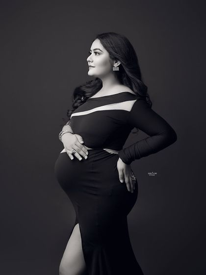 A powerful and dramatic black and white portrait. This mamma looks incredible in a black cutout gown that is both modern and elegant.