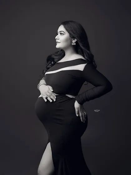 A powerful and dramatic black and white portrait. This mamma looks incredible in a black cutout gown that is both modern and elegant.