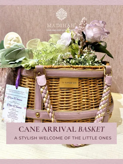 A stylish welcome for a little one with our Cane Arrival Basket. This hamper combines rustic charm with luxury, featuring a woven cane basket, soft floral arrangements, and a personalized announcement card.