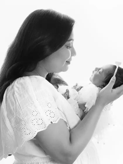 That incredible feeling when you have your whole world in your arms. A simple, classic black and white portrait of a mother and her newborn.