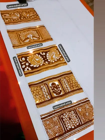 A variety of heavy border designs for bridal mehndi practice. This sheet includes designs with Ganesha, peacocks, and different floral patterns.