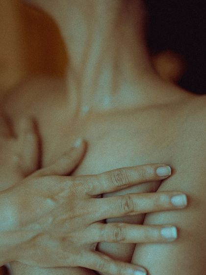 A fine art, boudoir-style detail shot focusing on form and texture. These abstract, intimate photos can be a beautiful and artistic part of a personal portrait session.