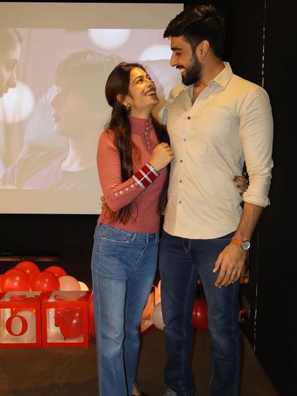 A happy couple celebrating a birthday in front of the big screen. The joy and love between them are what make these moments so special to be a part of.