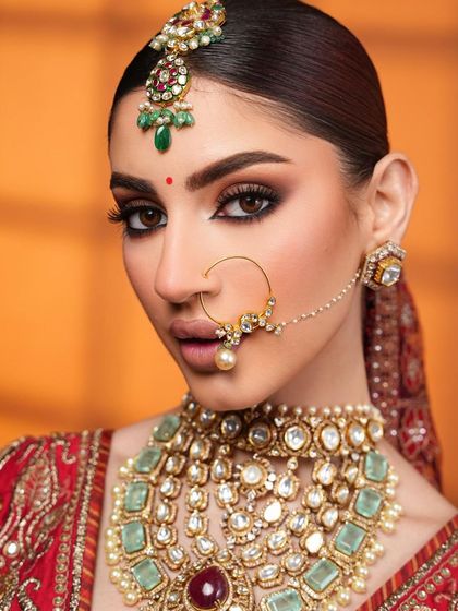 A close-up that highlights the perfect smokey eye and defined features.