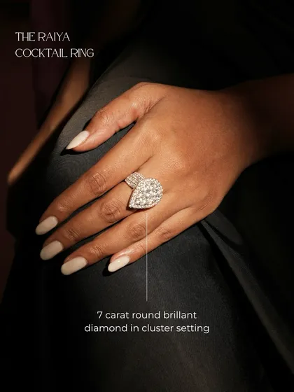 The Raiya Cocktail Ring is designed to be a center of power and light. It features a stunning 7-carat round brilliant diamond in a cluster setting that captures attention from every angle.