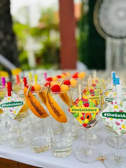 Fun and quirky details are my specialty. These custom glass tags with the hashtag #SheGotAdded add a playful element to the drinks, ensuring every detail aligns with your event's theme and story.