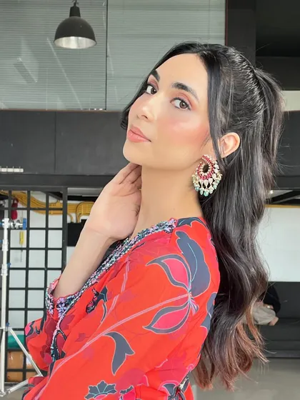 Another angle of this beautiful dewy look. The high ponytail is a great way to keep the hair off the face and show off the stunning earrings.