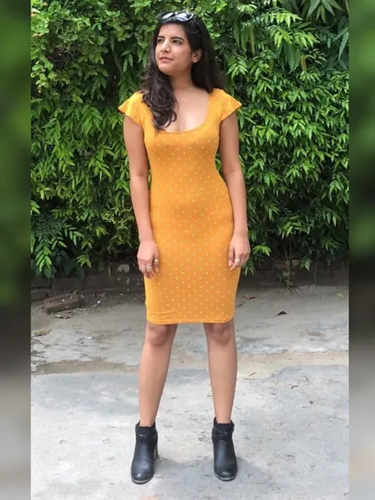 We channeled a retro vibe with this look. The polka-dotted bodycon dress in a vibrant mustard yellow is perfect for an hourglass figure. Paired with ankle boots, it's a fun and stylish outfit that proves dressing for your body type can be playful.