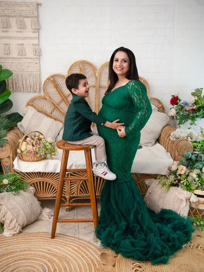 The joy of a growing family. We captured the beautiful anticipation of a mother awaiting her new arrival, and the pure excitement of a big brother to be, all within our cozy boho studio setup.