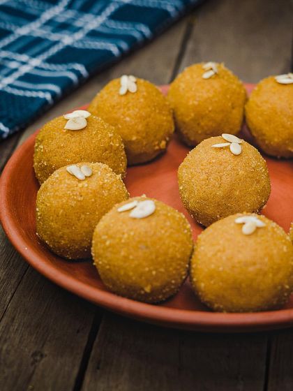Our classic Besan Laddoo, made from roasted gram flour, ghee, and sugar. Topped with almonds, it's a simple, timeless sweet that everyone loves.