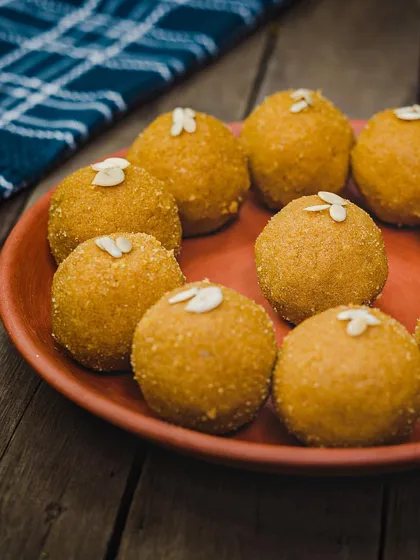 The humble but delicious Besan Laddoo. Made with roasted gram flour and desi ghee, it's a classic that never disappoints.