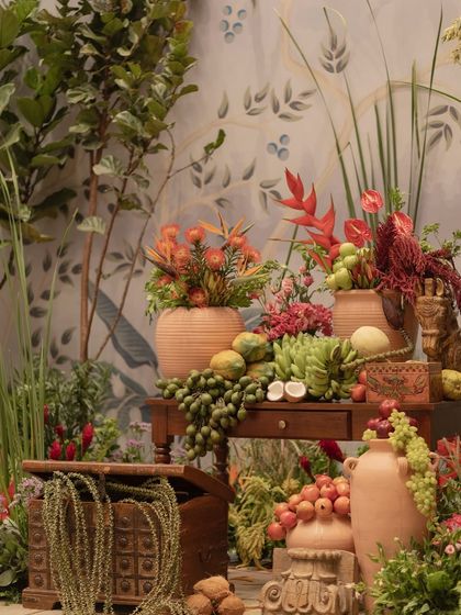 A still life of fruits and flowers from the 'Orchard of Life' event, symbolizing nature's bounty and the sweetness of new beginnings.