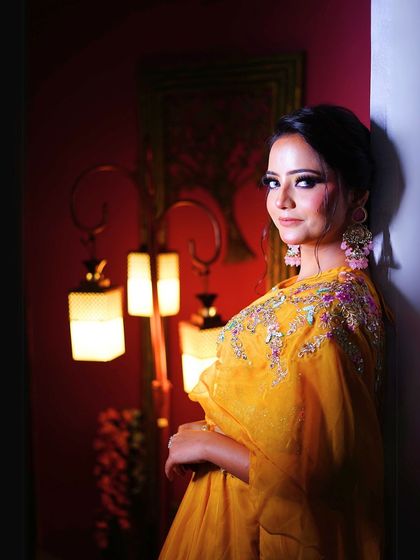 A dramatic, low-light shot that adds a touch of moodiness and focuses on the makeup.