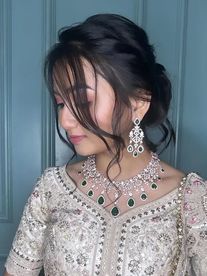 A sophisticated updo for a reception. This hairstyle is elegant and timeless, perfect for a formal evening event.