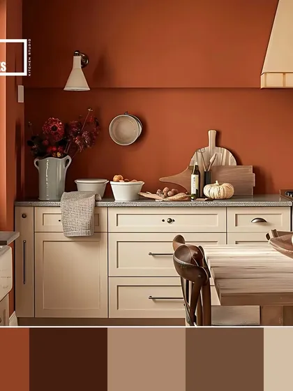 This earthy, rustic palette combines a deep terracotta wall color with off-white cabinets, creating a warm and cozy farmhouse-style kitchen.