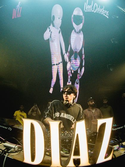 A fisheye lens view of my setup at Diaz, Goa, with cool robot visuals on the screen. My performances are a complete audio-visual experience.