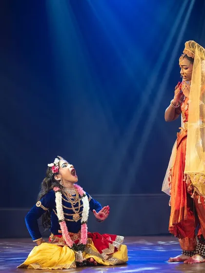 A dramatic scene showing Yashoda confronting a mischievous young Krishna. The expressive acting and storytelling are key to making our mythological productions relatable and engaging.