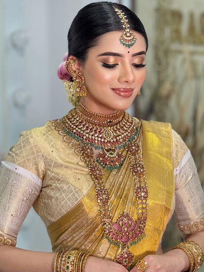 A serene, eyes-closed shot that focuses on the soft, blended eyeshadow and the flawless finish of the airbrush makeup.