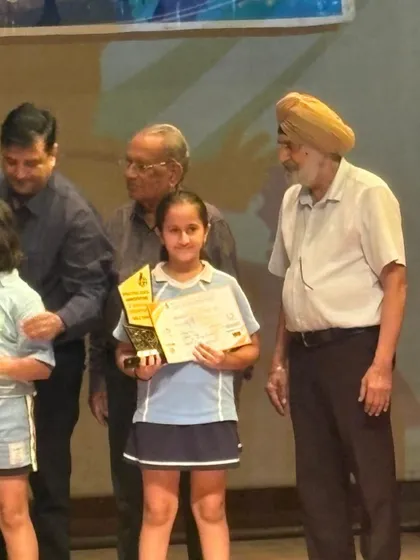 Heer Vohra on the stage receiving her award for 3rd place in the U-11 girls' category. Every tournament is a valuable learning experience, and I'm proud of her performance.