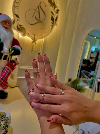 Our red French manicure is a popular choice during the holiday season, providing a clean yet festive look.