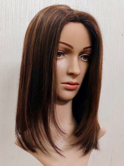 Another angle of our popular Silk Base 5x7 Topper. This view highlights the quality of the hair and the professional cut and styling.