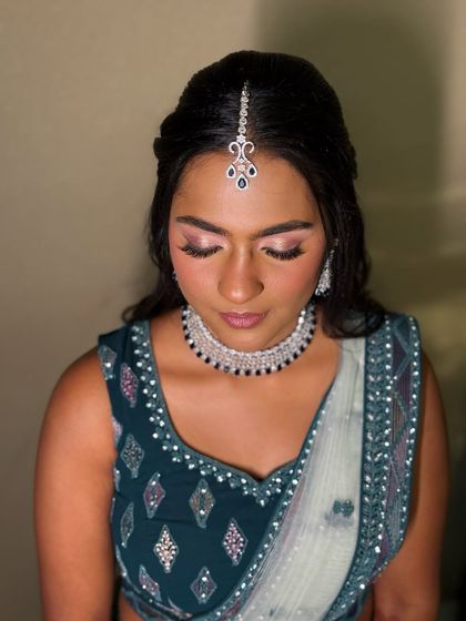 A close-up on the makeup, showing the detail of the winged liner and blended eyeshadow.