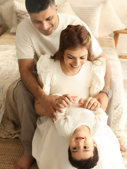 A moment of playful trust. This upside-down pose is full of giggles and shows the fun-loving relationship within the family. It’s these spontaneous moments that make the best memories.