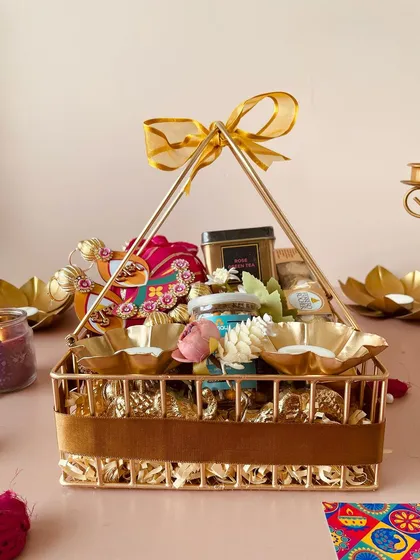 This luxe metal basket hamper is perfect for a grand Diwali gesture. It's filled with premium items and features a beautiful velvet ribbon.