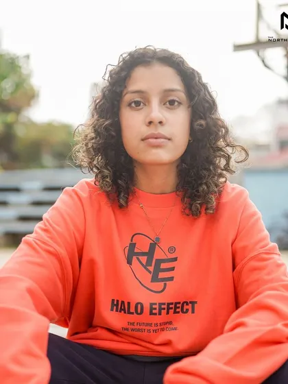 We're now stocking Halo Effect, a homegrown brand with a unique vision. This bright orange sweatshirt features their signature logo and is perfect for making a bold statement.
