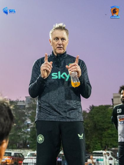 A moment of instruction during a team talk. Heimir shares his insights with our senior players, emphasizing the importance of communication and tactical discipline.