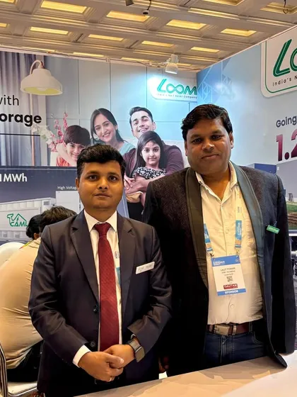 Two of our team members at our booth during the Mercom India Renewables Summit. We are proud to showcase the future of clean energy and our role in India's green transition.