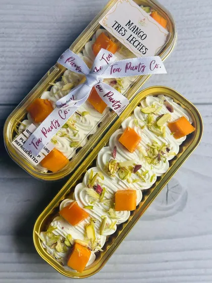 When mangoes are in season, my Mango Tres Leches boats are a must-try. A light sponge is soaked in creamy milk and topped with fresh mango chunks and pistachios.