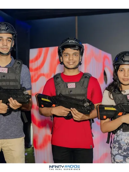 A team gets ready for their laser tag mission. Players are equipped with helmets and vests with glowing sensors, showing the professional-grade equipment I bring to every event.