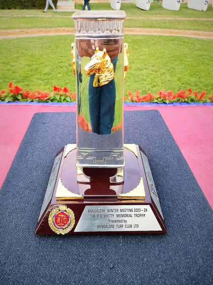 The P.V. Shetty Memorial Cup, featuring a golden horse head within a glass column.