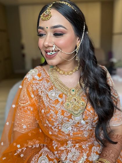 A lovely bride ready for her wedding. I styled her hair in a simple but elegant half-updo with soft waves, allowing her beautiful smile and traditional jewellery to be the main focus.